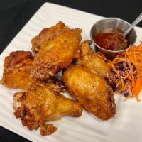 Golden Wings · Wings and drummets with sweet chili sauce.