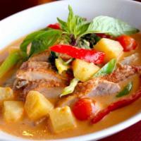 Duck curry · Slices of roast duck meat in red curry sauce, pineapple, tomato, bell pepper and basil