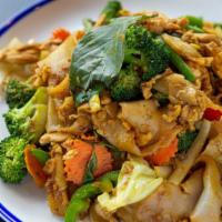 Golden Noodle · Thick rice noodles, egg, yellow curry, broccoli, onions, bell peppers, green beans, carrots ...