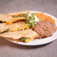 Breakfast Quesadilla · A large flour tortilla with eggs, spinach, mushrooms, cheese served with breakfast potatoes ...