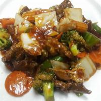 11. Hunan Style · Spice hunan sauce, baby corn, broccoli, bell pepper, cabbage, carrot. Served with fried rice.