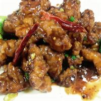 15. General Tso's · Spicy sweet sauce, crispy chicken, red pepper, scallion. Served with fried rice. Spicy.