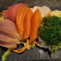 Chirashi · 12 pieces of sashimi over bed of sushi rice.