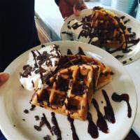 Coco Chocolate Waffle · Coco pebbles cooked into a Belgian waffle with organic chocolate sauce and whipped cream.