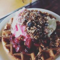 Fruit and Granola Waffle · Belgian waffle topped with granola, whipped cream, and seasonal fruit compote.