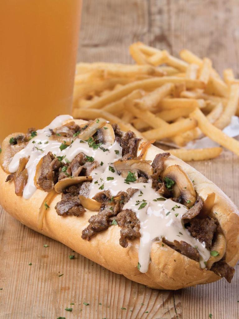 The Chipotle Philly · Grilled sirloin, caramelized onions and mushrooms, chipotle aioli and queso in a traditional hoagie
. 