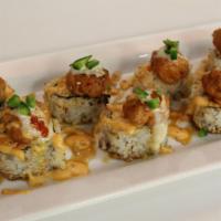 Mockingbird Baked Roll · In: spicy crab mix, cream cheese, and avocado. Out: spicy tuna, eel sauce, spicy mayo, wasab...