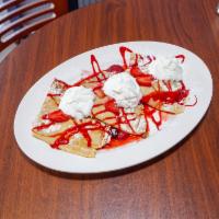 Strawberry and Wipped Cream Crepes · 3 crepes filled with fresh strawberries, sugar, and topped with whipped cream and raspberry ...
