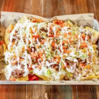 Nachos · Choice of meat, refried beans, queso dip, lettuce, tomato, jalapenos, and sour cream. Add tr...