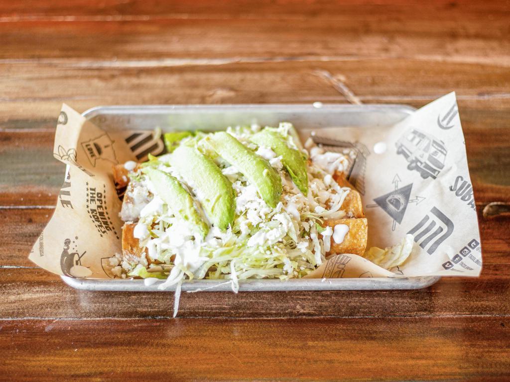 Flautas · 3 rolled and deep-fried tortillas filled with meat and topped with lettuce, avocado, queso fresco, and sour cream.