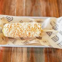 Mexican Street Corn · Corn on the cob with mayo, cheese, and chili powder.