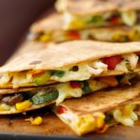 Quesadilla Classic* · Chicken or Steak, Grilled Onions, with mixed cheese,  very simple