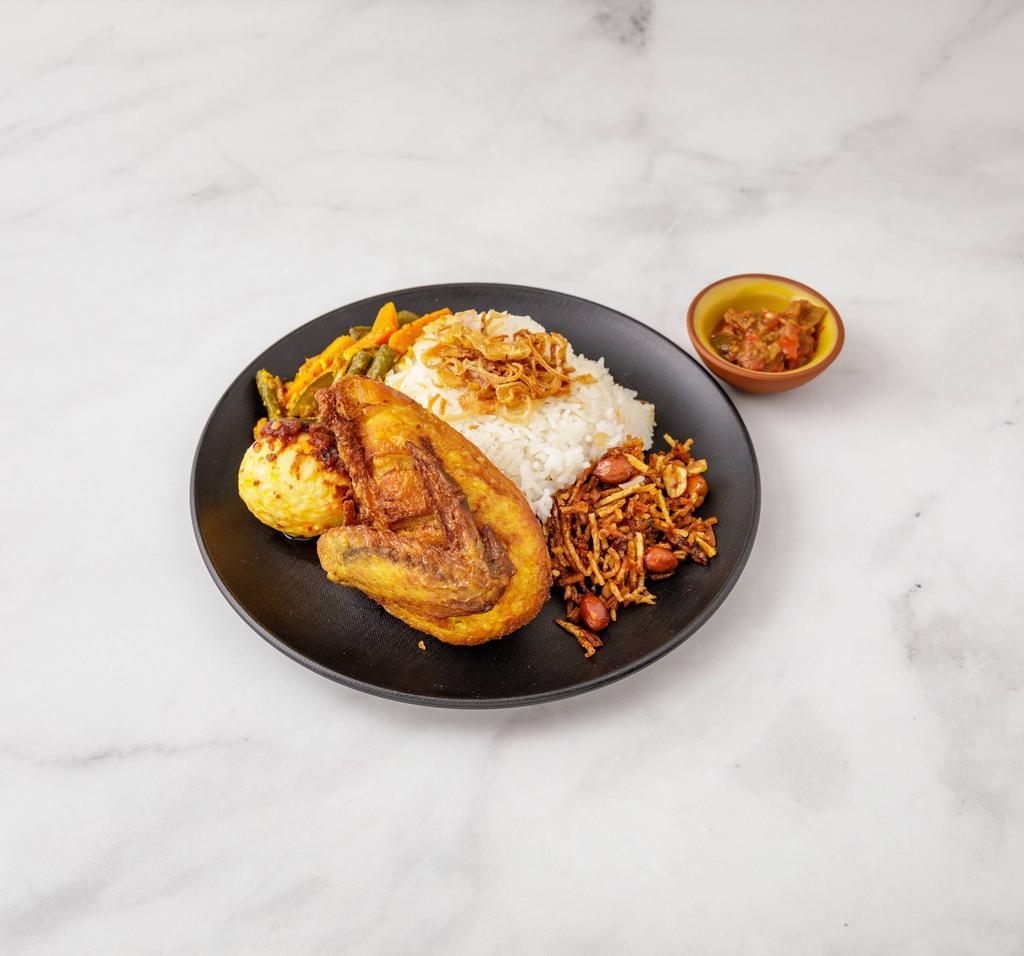 R1. Nasi Lemak Ayam Goreng · Coconut rice with fried chicken, spicy egg, anchovy and assorted pickles.