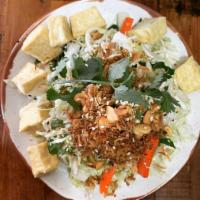 Vietnamese Coleslaw · Vegan! Shredded cabbage, pickled carrots & daikon, basil, fried shallots, crushed cashews, a...