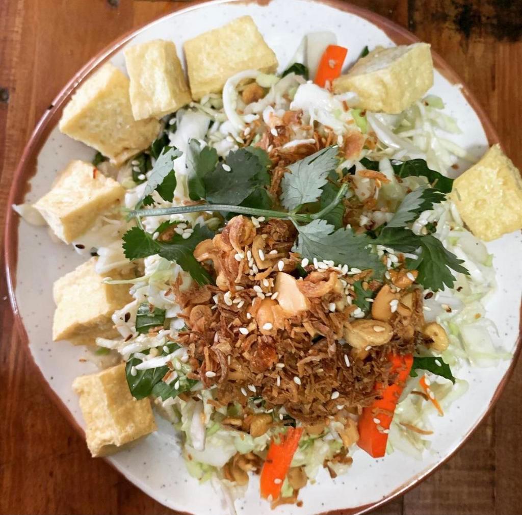 Vietnamese Coleslaw · Vegan! Shredded cabbage, pickled carrots & daikon, basil, fried shallots, crushed cashews, and sesame seeds. Your choice of tofu, chicken, or no topping.
(COLESLAW CONTAINS CASHEW)