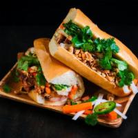Roasted Pork Belly Sandwich · Vietnamese baguette, roasted pork belly, mayo, cucumber, pickled carrots & daikon, jalapeños...
