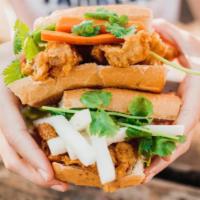 Chicken Katsu Sandwich · Vietnamese baguette, fried chicken, mayo, cucumber, pickled carrots & daikon, jalapeños, and...