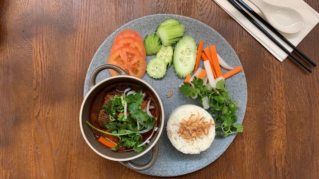 Star Anise Beef Stew Rice Bowl · Beef stew topped with green & white onions and cilantro. Jasmine rice, mixed spring greens, pickled carrot & daikon, cucumber, tomato, cilantro, and jalapeños served on the side, topped with crispy shallots. (Not gluten free.)
