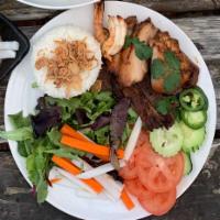 Combo Rice Bowl · Grilled lemongrass chicken, grilled pork, grilled shrimp, jasmine rice, mixed spring greens,...