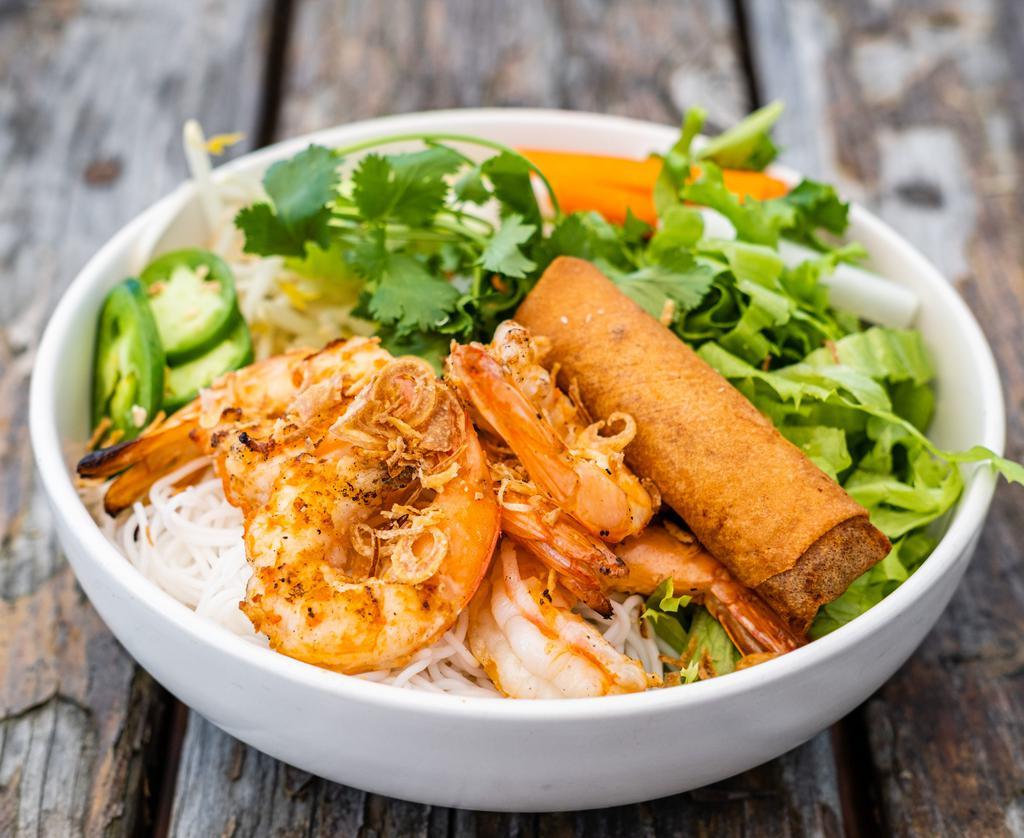 Grilled Shrimp Vermicelli Bowl · Grilled shrimp, vermicelli rice noodles, lettuce, fresh herbs, cucumber, beansprouts, pickled carrot & daikon, jalapeños, and topped with crushed cashews and crispy shallots. Served with fish sauce and a mung bean & taro egg roll. (Not gluten free.)