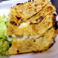 Quesadilla with Meat · Large flour tortilla filled with cheese and meat served with guacamole and sour cream 