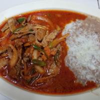 Steak Picado · Chopped steak stir-fried with bell peppers, onion, and tomato sauce. Served with rice, beans...