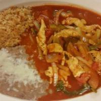 Pollo Picado · Chopped chicken breast stir-fried with bell peppers, onion, and tomato sauce. Served with ri...