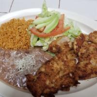 Milanesa de Pollo · Breaded chicken breast. Served with rice, Beans and salad