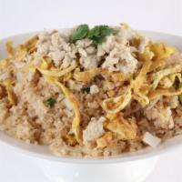 Crab Fried Rice · Crab nugget stir fried with egg, green onion, onion, and Jasmine rice.  Topped with shredded...
