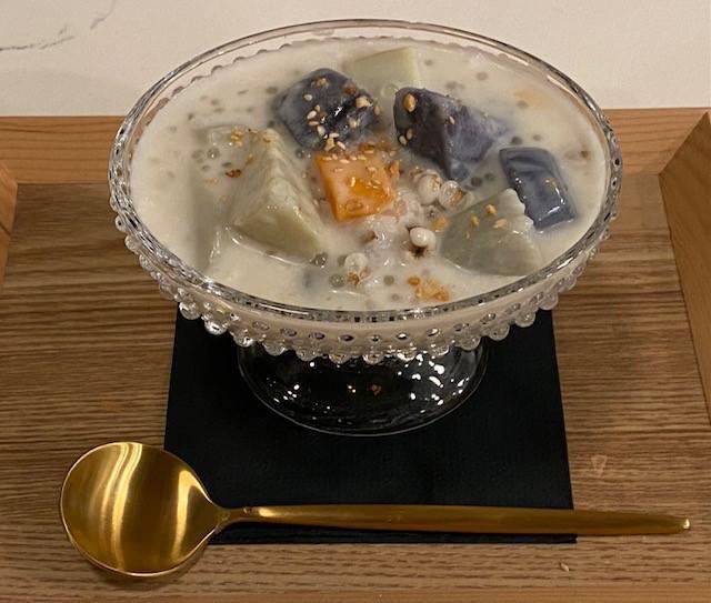 Sam Cha in Coconut Milk (Warm) · Satsuma Imo sweet potato, purple yam, red yam, pearl barley and tapioca simmered in warm sweetened coconut milk.  Topped with toasted crunched sesame and peanut. (Vegan)