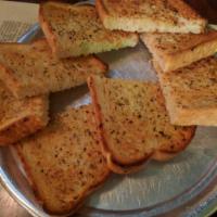 Garlic Bread with marinara sauce · Fresh chopped garlic, butter and spices on oven baked bread.