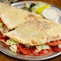 Stromboli · Sliced ham, salami, Swiss cheese, black olives, onions, and creamy Italian dressing, and ove...