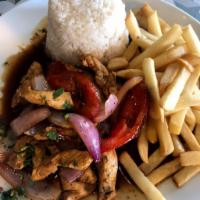 Pollo Saltado con Arroz Blanco · Sauteed chicken with tomatoes, onions, and cilantro. Served over French fries and white rice