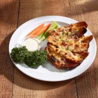 Potato Skins · Hickory-smoked bacon, cheddar cheese, Jack cheese, topped with green onions. Served with cel...