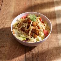 Thai High Chicken Salad · Chopped chicken then wok seared in sweet and sour dressing, served on iceberg mix, carrots, ...