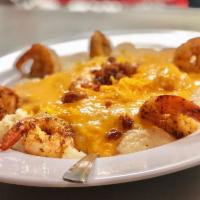 Shrimp and Grits · Blackened shrimp and creamy southern grits smothered with our tasty lobster bisque, bacon cr...