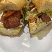 Spicy Cajun Sausage Po-Boy · Served with coleslaw and mustard.