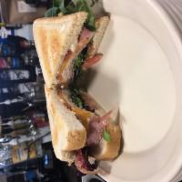Club Sandwich · Boar's Head turkey, ham, bacon, cheddar cheese, lettuce springs, tomato and mayo.