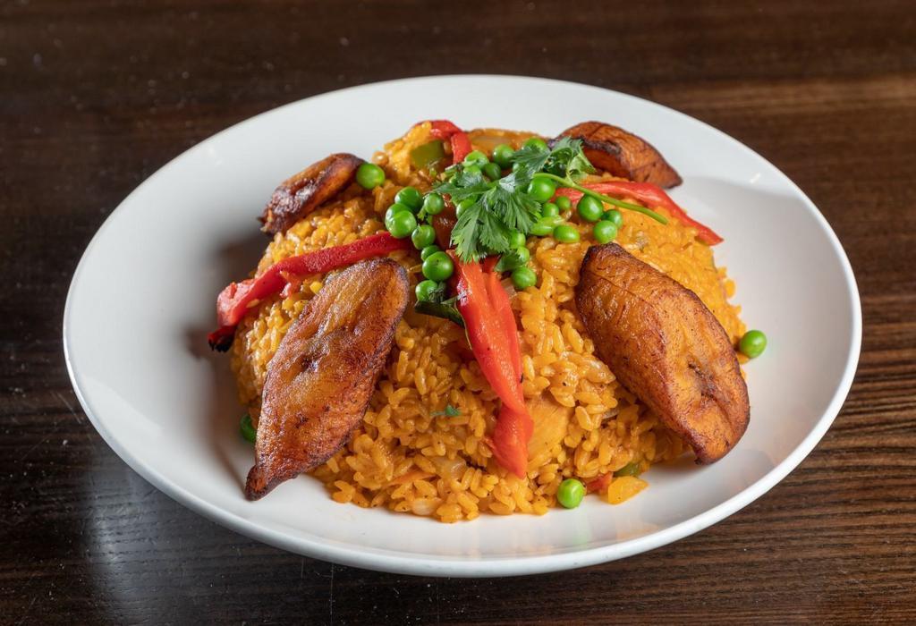 Arroz con Pollo · A Cuban classic. Chicken with yellow rice served with sweet plantain.