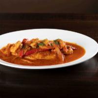 El Pescador · Grilled filet of fish topped with shrimp, simmered in a creole sauce, served with white rice...