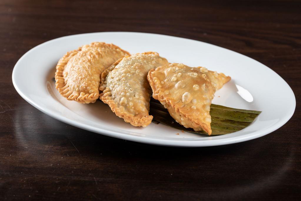 Trio de Empanadas · The Cuban empanada trio is our traditional fresh empanadas made to order and served with our Rumba's sauce. Your choice of protein.