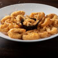 Calamares Rumberos · Crunchy and sweet fried calamari simmered in a  sweet chili sauce.