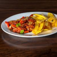 Chorizo Salteado · Sauteed Spanish sausage with onions, peppers, and a hint of garlic served with plantain chips.