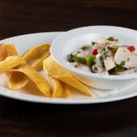 Ceviche de Pescado Tradicional · Traditional fish ceviche marinated fish in lime juice, red onions, and cilantro served with ...