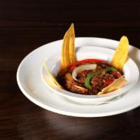 Ropa Vieja · Literally means old clothes. A Cuban classic .Braised shredded beef simmered with tomatoes, ...