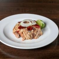 Lechon Asado · Our famous Cuban pork. Cuban style roasted pork, 24-hour marinated, topped with grilled onio...