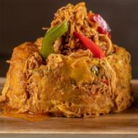 Monfongo de Pollo · Chicken. Shredded chicken simmered in a light tomato sauce with peppers.