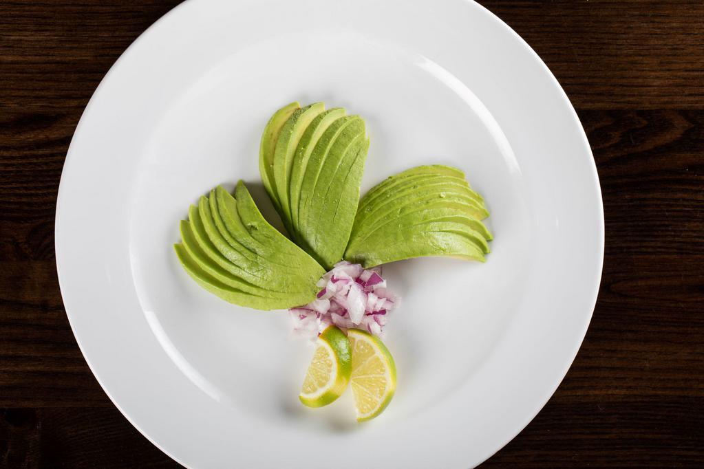 Ensalada de Aguacate · Avocado salad. Fresh sliced avocado topped with onions.