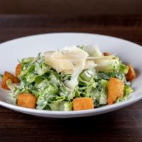 Ensalada de Caesar Caribena · Hearts of romaine tossed in a homemade cilantro Caesar dressing topped with yuca croutons an...