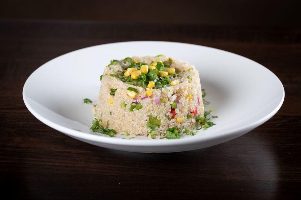 Ensalada de Quinoa con Vegetales · Quinoa salad with vegetables. Fresh quinoa with house dressing and tossed with fresh shucked corn, peppers, onions, and cilantro.